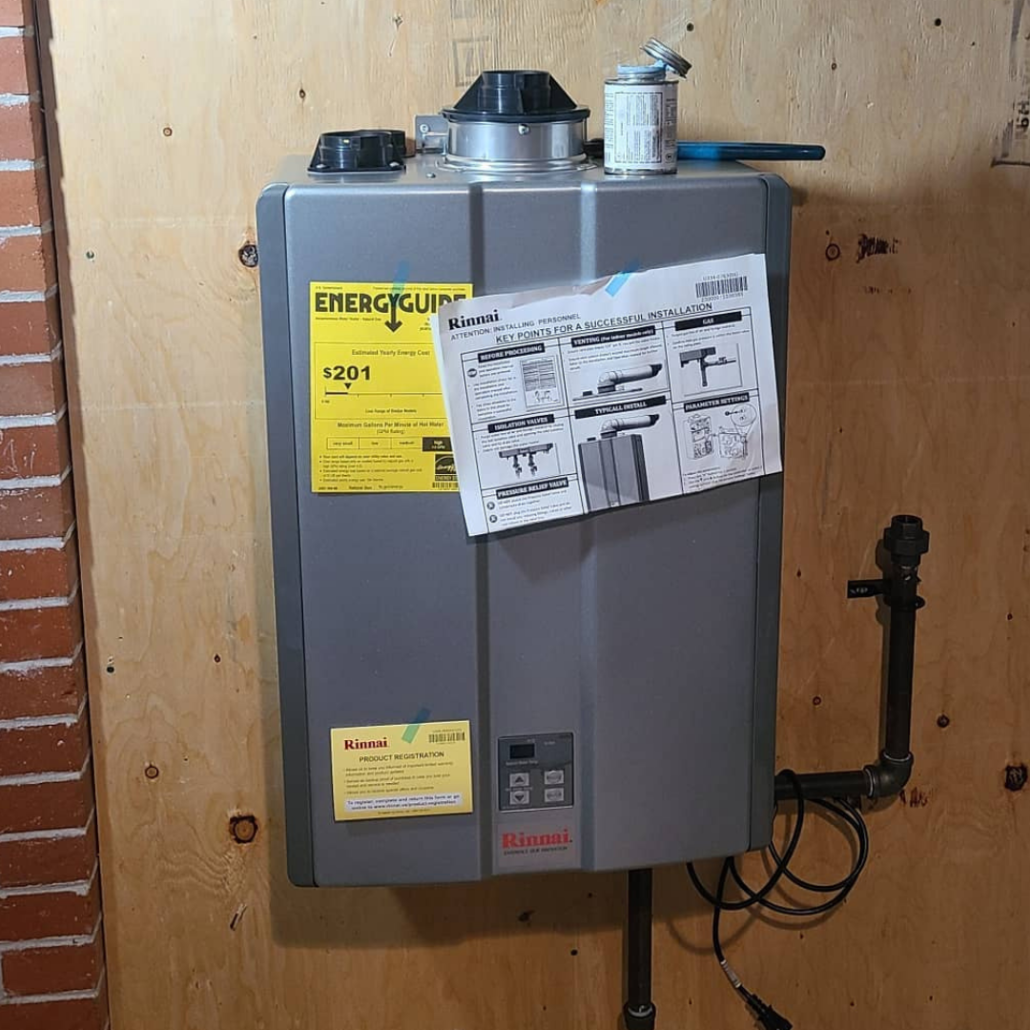 Tankless Water Heater Problems: When to Call for Service 2 Rinnai tankless water heater during installation in a Nanaimo home